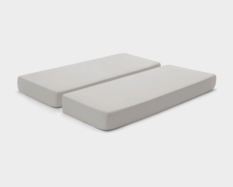 Adjustable bed fitted sheets by It-Fits in neutral Beige, displayed on a split mattress with deep pockets against a simple backdrop.