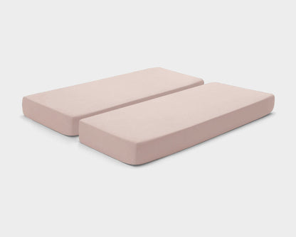 Stretchy, easy-care fitted sheets in Dusty Pink by It-Fits, shown on a split king mattress with deep pockets against a plain background.