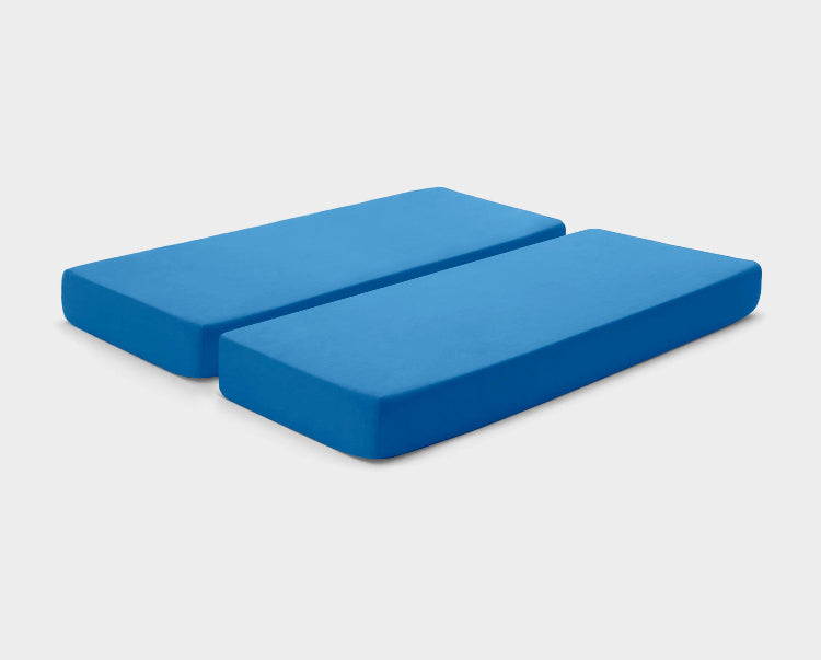 Adjustable bed sheets by It-Fits in Royal Blue, shown on a dual queen mattress with deep pockets against a plain background.