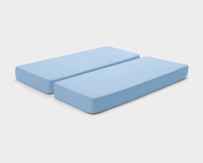 It-Fits fitted sheets for adjustable beds in Sky Blue, shown on a dual king mattress with deep pockets against a plain background.